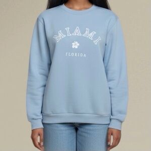 (NWOT) Shein Women’s Miami Florida Light Blue Sweatshirt. Medium